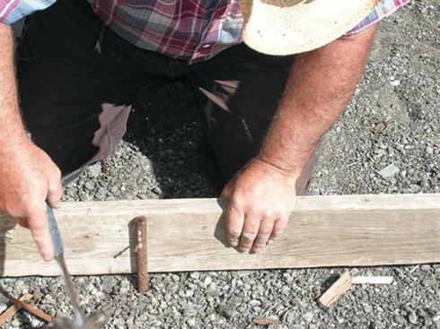 Steel form stakes have nail holes predrilled in them to support concrete forms.