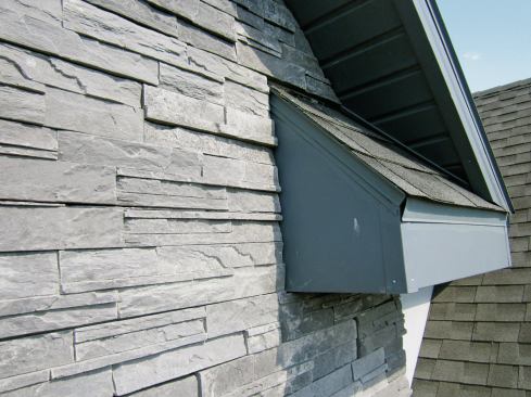 Along the small section of roof above a rake return, we need a weep screed above the shingles.