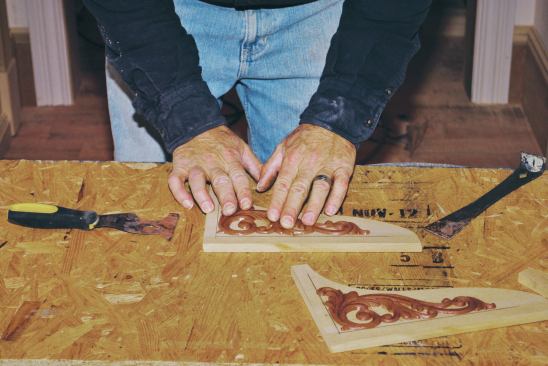 ... I position it and press it down until it begins to cool and the glue adheres.