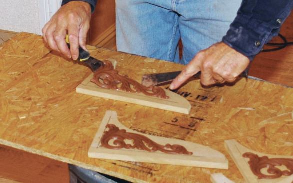 After sliding the ornament off the putty knives ...