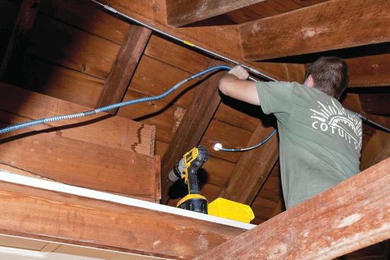 Two parallel runs of metal-clad cable conduct power from the rooftop array to the service entrance.