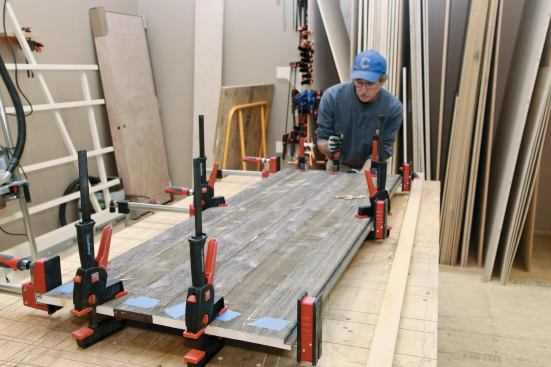 Squeeze clamps pulled the glue-up tight to the bar clamps and helped keep the panels flat.