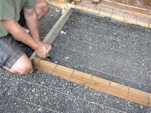 Steel mesh or rebar improves a concrete slab’s ability to handle tension loads.