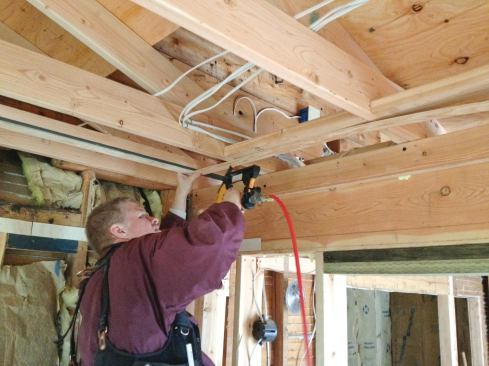 To bring the 5/8-inch ceiling drywall, 1/2-inch wall drywall, and 1/4-inch flexible drywall that would be used to form the cove into the same plane, 1/4-inch plywood furring strips needed to be attached to the blocking.