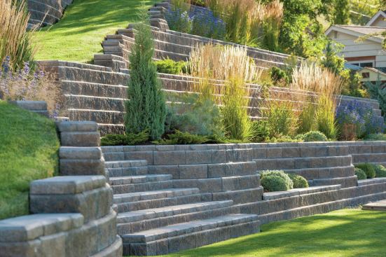 Segmental retaining walls can be used to create planting areas on a steep slope.