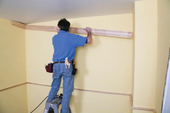 The coped end of the first piece of crown is snugged against the starter piece.