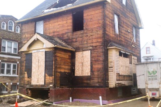 The six DER houses received continuous exterior insulation as part of the plan to achieve a deeper level of energy reduction. To save money, the plan was to apply the foam over the existing siding, but after the first house treated this way was tested, the decision was made to strip the remaining homes down to the sheathing to achieve better air-sealing numbers.