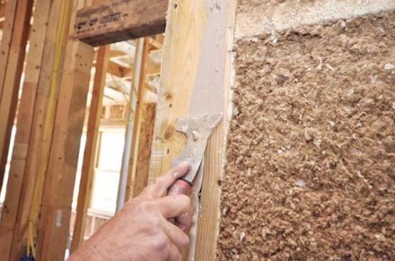 To prevent interference with the drywall and trim, caulk at framing members is immediately tooled flat.