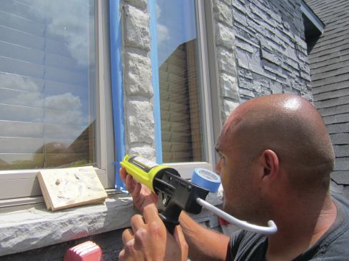 ... and (after taping off the windows with blue painter's tape) finished with a bead of sealant.