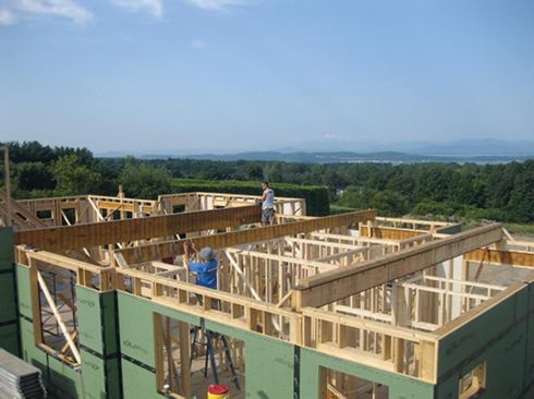 Once the first-floor walls were in place, the crew could install the second-floor support beams.