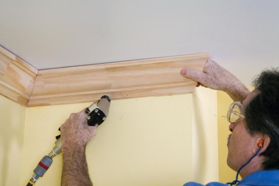 Outside corners are gently tacked so the miter can be adjusted if needed.