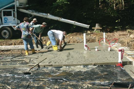 For large slabs, intermediate screed supports are used. As the slab progresses, the screed supports are removed and the resulting voids are shoveled full of concrete.