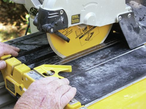CHECK BLADE TRACKING AND FENCE 

Using the combination square, make sure the blade is parallel to the sliding table (3). Check at the beginning as well as the end of the table’s travel. Then adjust the saw’s fence so that it is square to the table and blade (4). 