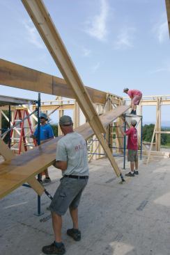 However,  one large 5 1/4-inch-wide by 24-inch-deep by 28-foot-long beam built up from three 1 3/4-inch by 24-inch LVLs was not. This allowed the crew to verify the length of the span, then cut and fit the beam one ply at a time.
