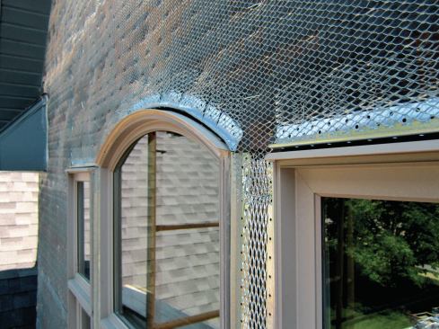 At the head we install a weep screed, followed by metal lath.