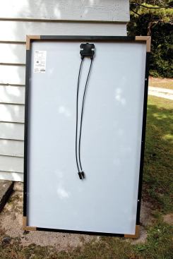 Each panel’s DC output passes through a pair of wire leads on the back.