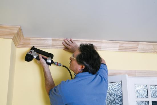 He starts fastening at the coped end.