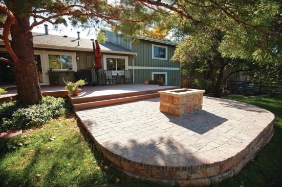 The gas fire feature is custom-built of concrete block with a stone veneer.