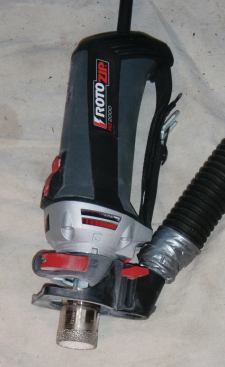 ANOTHER WAY TO CUT HOLES 

IN TILE

As an alternative to wet-cutting holes — particularly useful when cutting holes in tiles that are already installed — I use a variable-speed router-type tool made by RotoZip (rotozip.com), fitted with the company’s companion dry-cutting diamond hole saw (25). Rather than use a guide, I rely on a technique popular with stone fabricators. First I mark the position of the hole, then I introduce the bit into the face of the tile while holding the tool at an angle. As the bit eats into the tile, I gradually tilt the tool upward until the axis of the bit is square to the face of the tile. Now I can ease the bit through the body of the tile. 