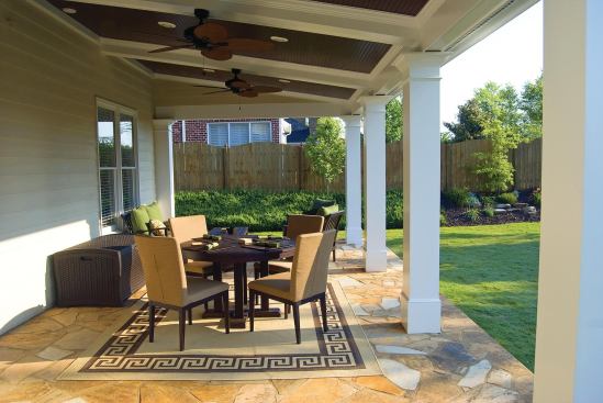A hardscape patio can be covered with a porch roof in a hybrid project.