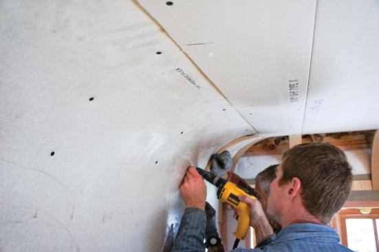 Once the panels conformed to the cove, they were screwed in place with regular drywall fasteners on 5-inch centers.