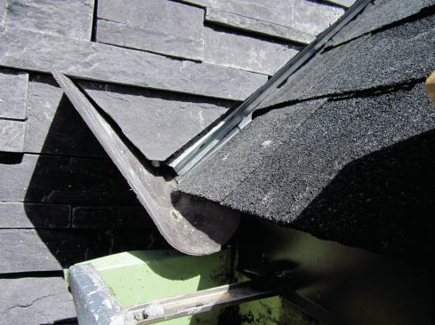 To do it right, we used a pre-formed kick-out flashing by DryFlekt at the base of the run.