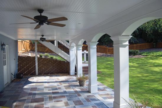 With the addition of an under-deck drainage system and a patio, the space below a deck becomes a dry, shady refuge.