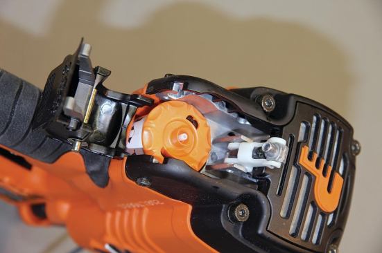 The new style of fuel cell is very easy to load: Drop in the fuel cell, swing down the connector, and latch the cover over it.