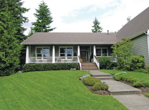 The homeowner wanted the new deck railing to have tapered posts that matched the style of these columns on her front porch. 