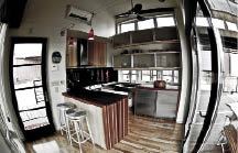 The kitchen includes all the amenities for Louisiana-style hospitality. The undercounter refrigerator-freezer (by Perlick) saves energy by using a single compressor.