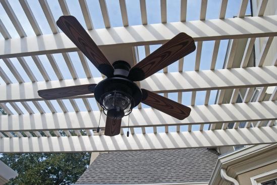 Mounting a ceiling fan attractively requires cooperation between the carpenters and the electrician.