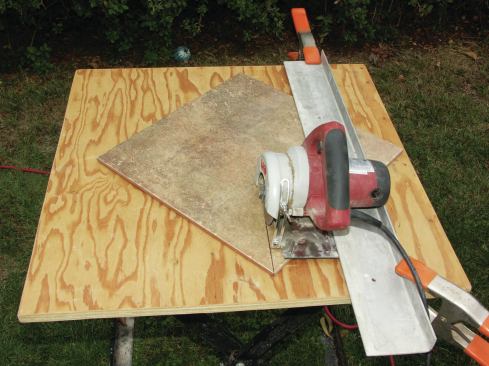 CIRCULAR SAW WITH A DIAMOND BLADE

When it comes to making diagonal cuts in large tiles, my wet saws often fall short. Larger-capacity wet saws are available, but they can cost $5,000 or more, and their massive size requires two people for transport and setup. Instead I clamp a straightedge to my work table and cut the tile with a small circular saw fitted with a diamond blade (20). This setup is a very low-cost alternative that’s easy to transport and carry. I use the same saw to cut through grout joints when I’m replacing individual tiles, and to make tile rip-outs easier. The smooth action of the blade is not nearly as destructive to neighboring tiles as 

a hammer and chisel.

