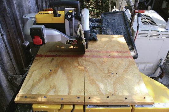 MODIFYING THE SAW FOR CUTTING GLASS TILE

Special wet-saw blades are available for cutting glass, but chatter from the saw table can still break the tiles. So can excessive heat where the blade meets the glass. Also, the wide kerf slots on the table don’t offer adequate support, which can result in chipped edges along the cut.

To minimize these problems, I bolt a square piece of 1/2-inch plywood — large enough to fully support the glass tiles — to the table. Then I submerge a second coolant pump in the catch basin. I wrap this added hose with stainless-steel wire, which stiffens it, but is flexible enough for me to direct the flow of water precisely onto the edge of the blade (9). Finally, with the coolant water flowing, 

I make a shallow cut in the plywood. The resulting narrow kerf provides maximum support for the tile, with significantly less chipping and fewer broken tiles.