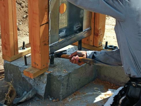 Accurately locating bolts during layout is a key step—and even with a good layout, panels may have to be persuaded into place.
