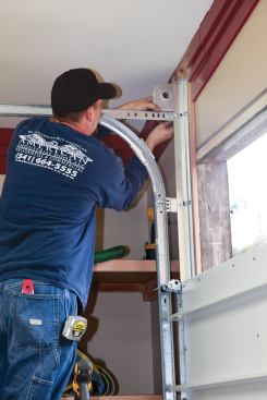 The door company used special track-mounting hardware to accommodate the 3 1/4-inch-thick door.
