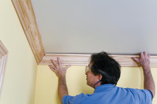 Finally, the still-unattached coped end of the first piece is snugged into place,