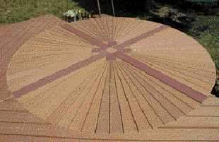 Figure 8. Wedge-shaped decking boards make up the fan pattern. Dividing the circle into quadrants with a cross pattern facilitates installation and creates a distinctive motif.