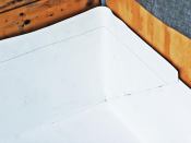 Seams at inside corners leave a potential pinhole leak where the deck and walls intersect.
