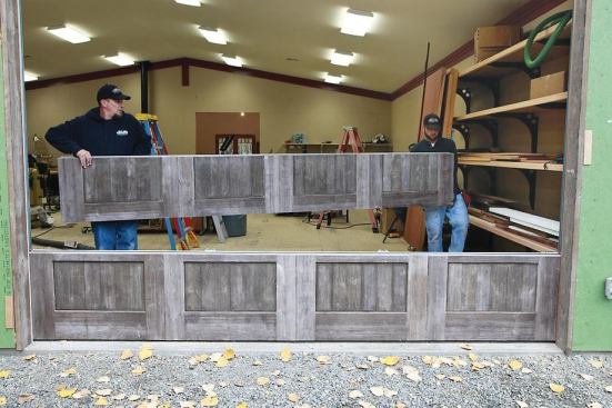 Each of the five roll-up panels weighs 120 pounds.