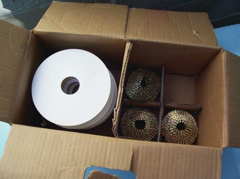 Hitachi sells fasteners by the case, packing the 350-nail coils and 350-cap reels (4 of each) in a cardboard box with dividers that keep them rolls from uncoiling.