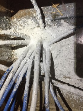 Wires need to be drenched in elastomeric, then pulled apart and wiggled so that liquid surrounds all the wires and sinks into the hole, thus sealing around each wire. We call this “puddle sealing.” This section took about two minutes.