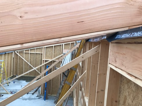 The inside edge is picked up by the ceiling drywall, which serves as the air barrier on the lid. 