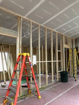 In this home by Aarow Building, the ceiling serves as the air barrier at the lid. Partition walls are framed after teh ceiling drywall has been hung. Note, that while the cracks in the drywall at top plates line do not create air leaks (a drastic reduction in air leakage), the hole for wiring and other mechanical penetrations will still need to be air sealed.
