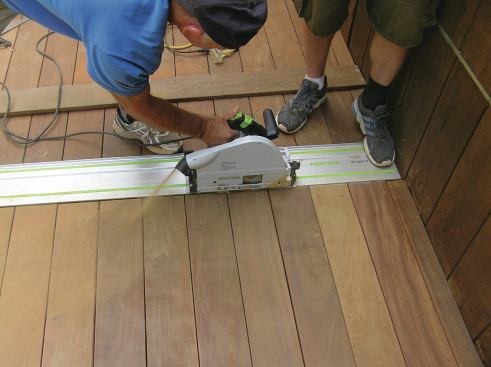 Because the track has rubber strips on the bottom, a little foot pressure is all that’s needed to keep the track from slipping during the cut.