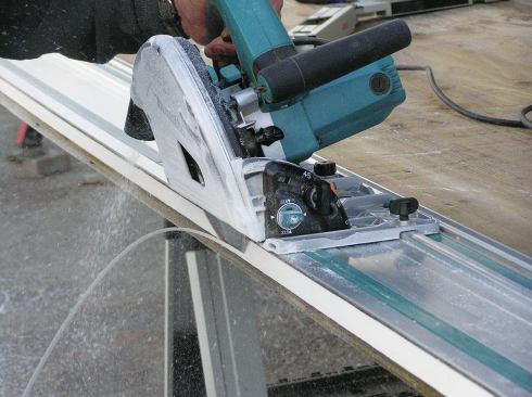 Instead of buying PVC trim boards, the author buys PVC in 4x8 sheets, then quickly and accurately rips his trim to the exact size needed with his track saw. 