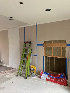 Once gas and electric lines were run to the fireplace, the wall could be insulated.