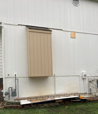 To complete the bump-out,  siding, trim, and roofing were installed. 