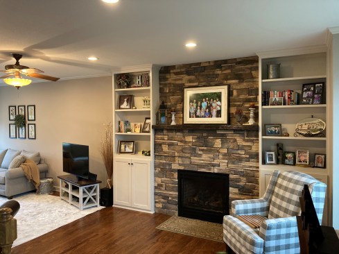 The author and his business partner, Joe Cook, built and installed the cabinets, while subcontractors installed the fireplace, stone, and hardwood flooring.