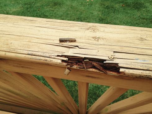 This deck was built in the mid-Atlantic area in 2005 using ACQ-lumber treated for above-ground use. The 5/4x6 cap rail shows clear signs of premature rot.