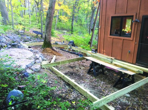 The author installed cantilevered joists over dropped beams, running the joists long.